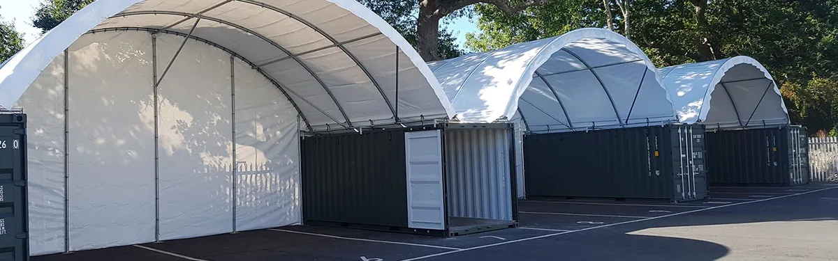 Covered storage bays with containers