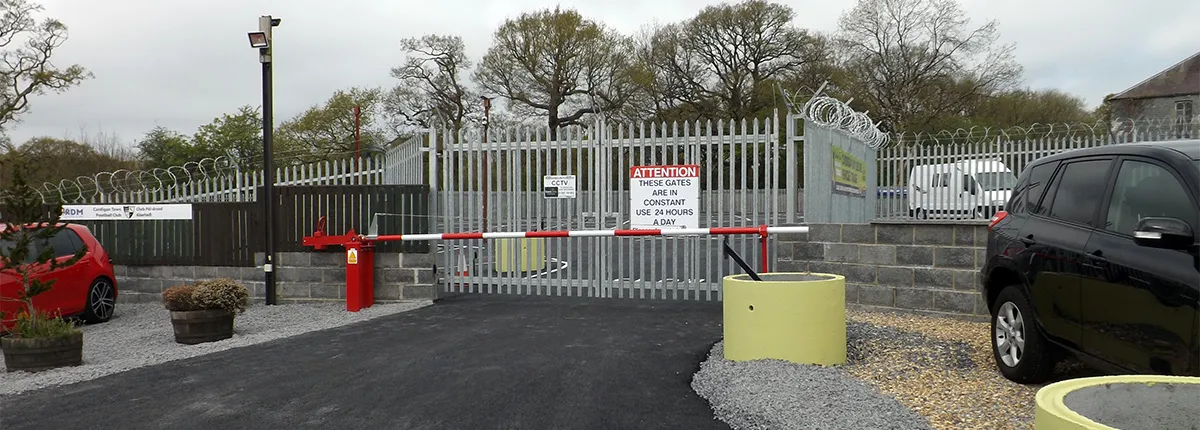 Palisade entrance gates and barrier at the storage site